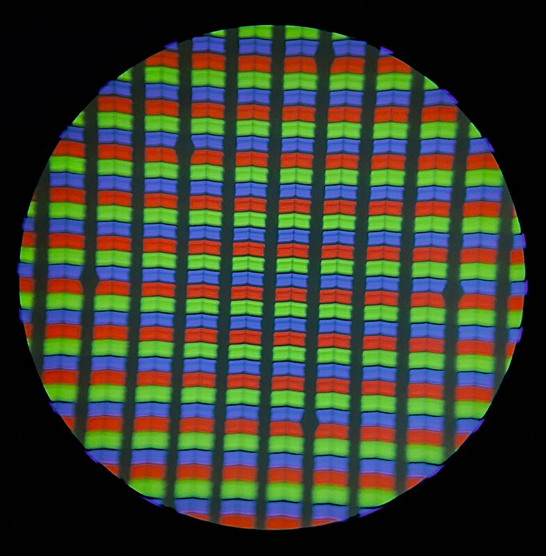 Red, green, and blue subpixels on a mobile phone LCD screen, magnified under a microscope.
