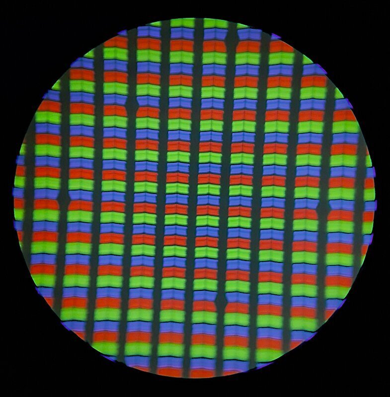 Red, green, and blue subpixels on a mobile phone LCD screen, magnified under a microscope.