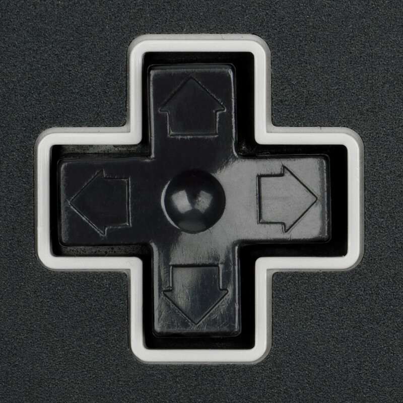 A 4-direction D-pad rocker: up, down, left, right are simply separate buttons underneath.
