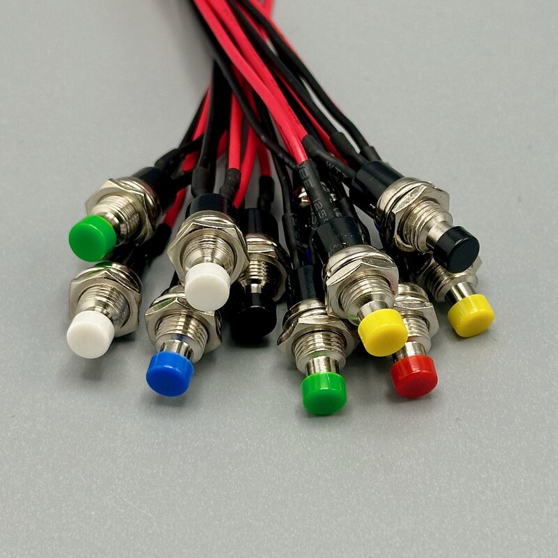 A panel-mount momentary switch that makes contact only while held down, available in normally-open and normally-closed versions. Photo by the Author